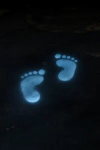 glowing blue footsteps symbolizing the shoes of peace and walking in Christ’s peace